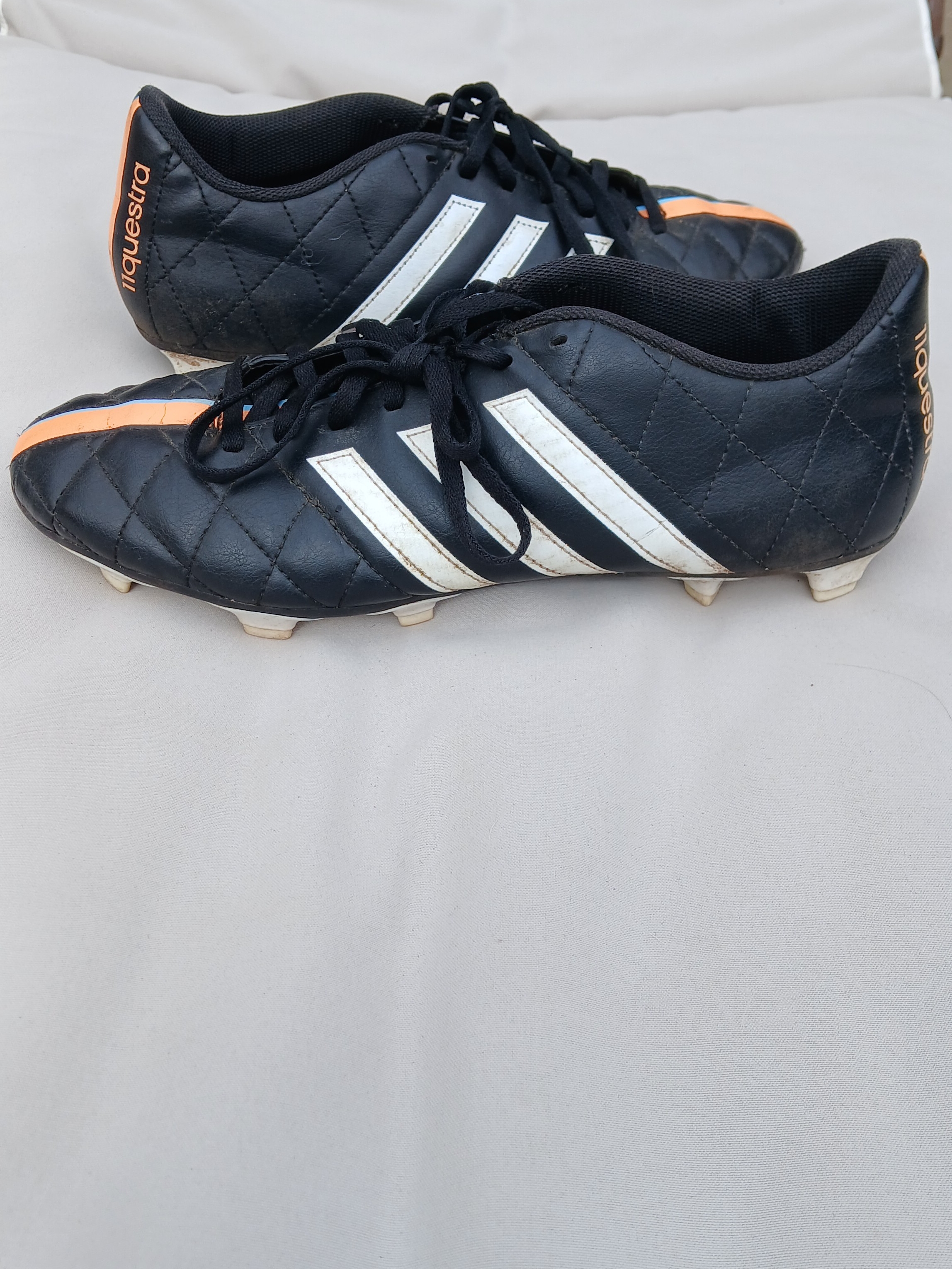 Adidas 11questra Black Quilted Soccer Cleats With White Stripes & Orange Accents